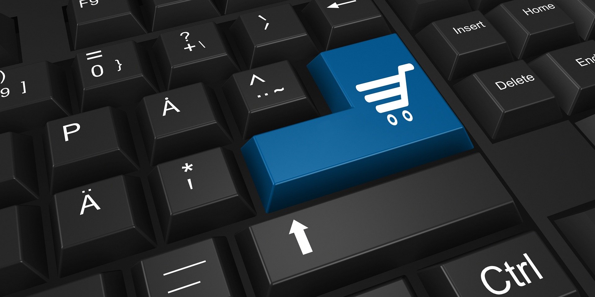 Einkaufswagentaste auf Tastatur als Symbol für Online-Shopping